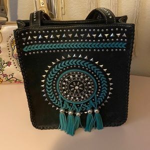 Montana West purse. With turquoise leather work, and silver studding on front